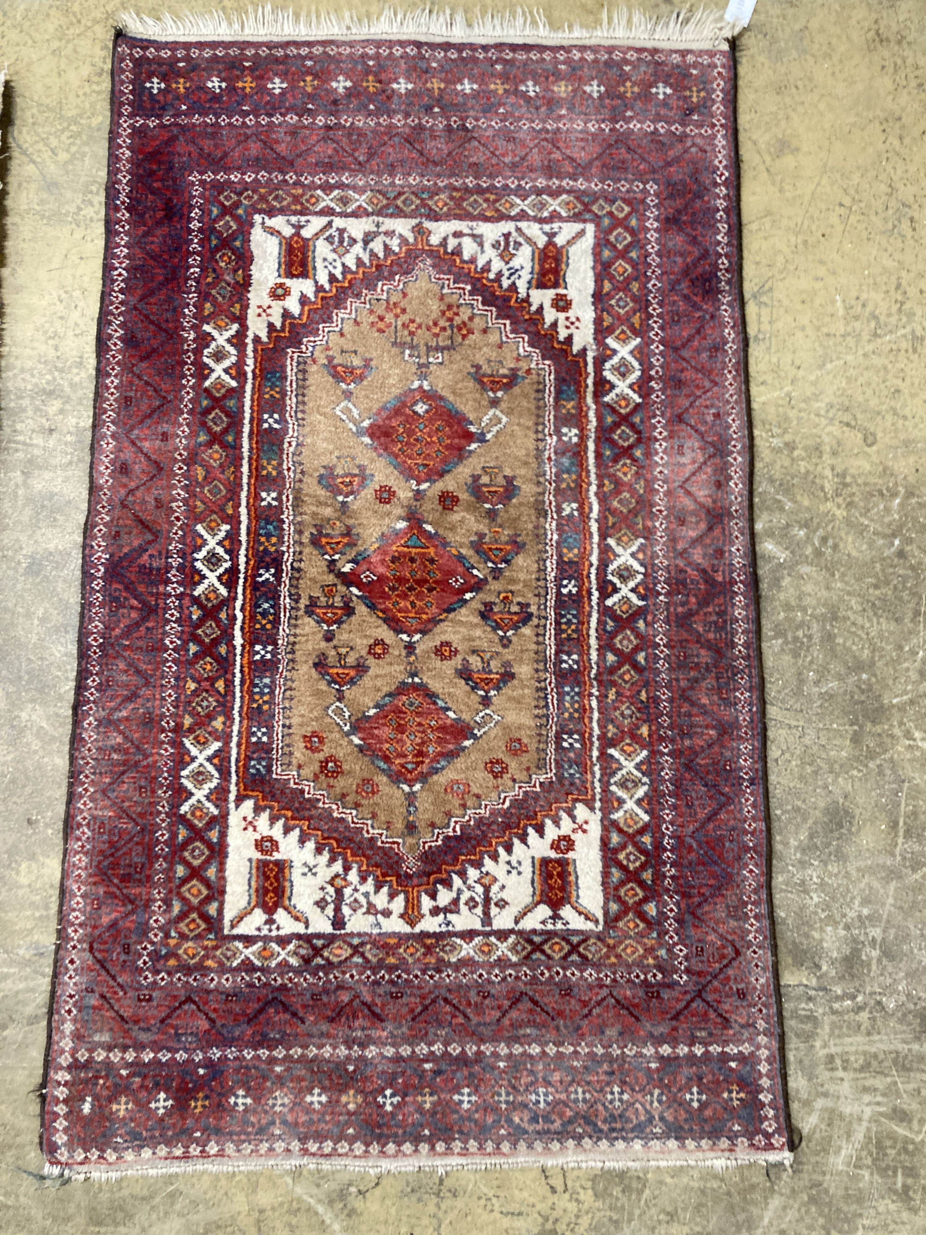 A Caucasian design red ground rug, 206 x 134cm together with a smaller West Persian design rug